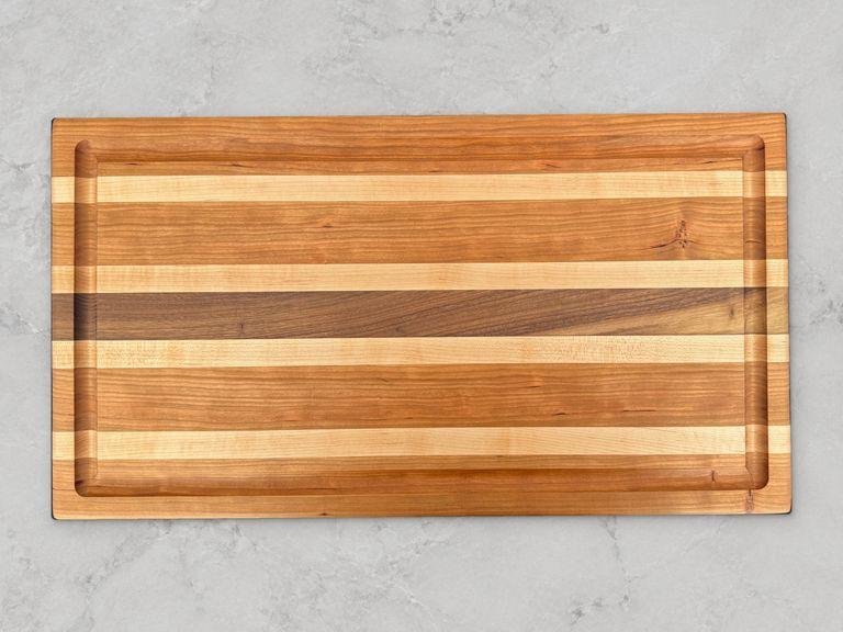 Cherry edge-grain cutting board with accent stripes