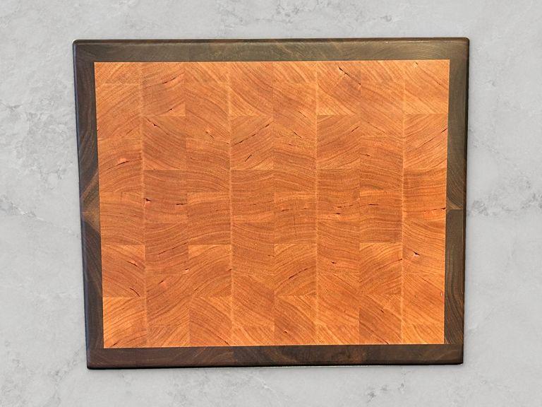 Cherry end-grain cutting board with walnut boarder