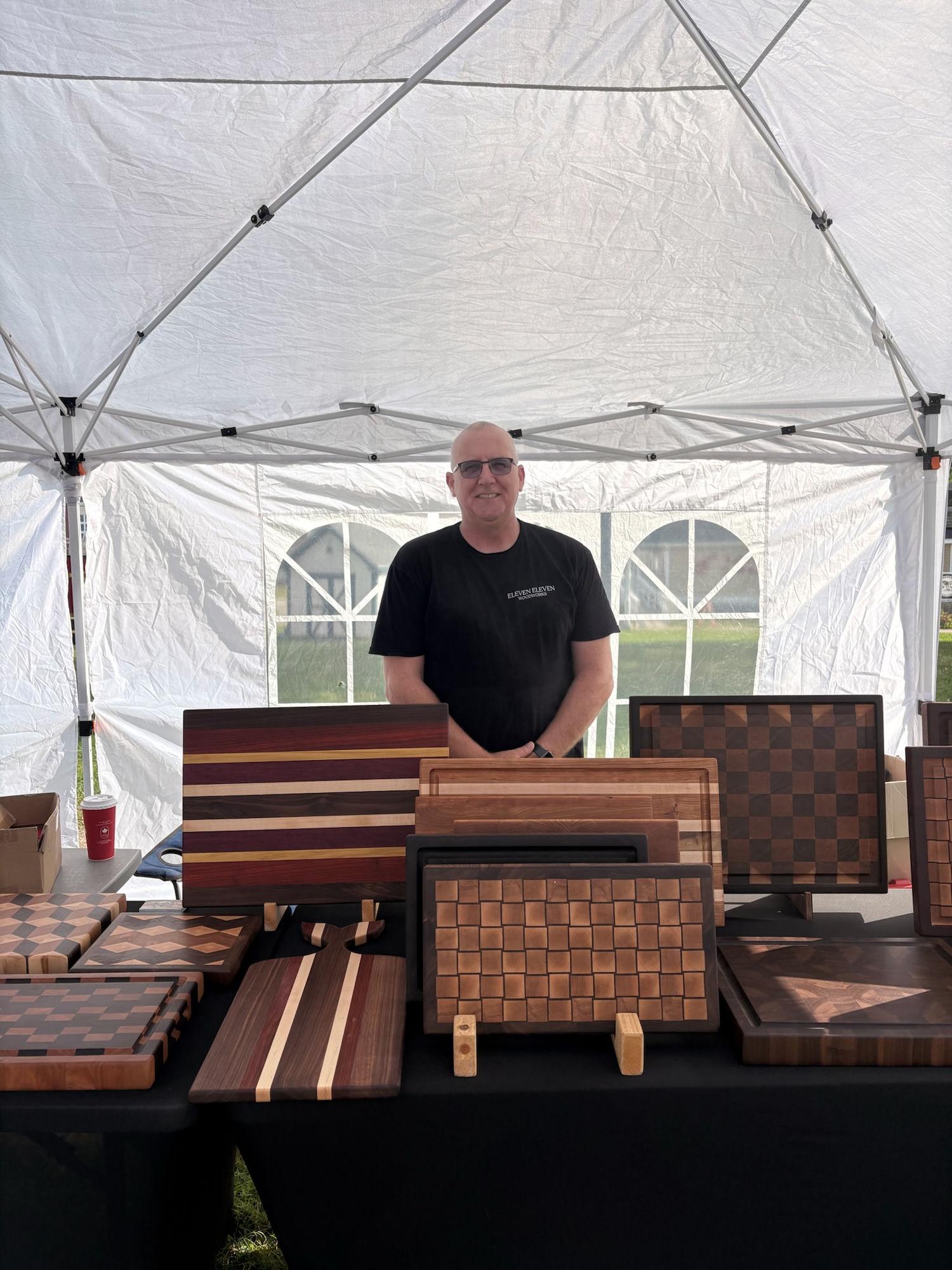 Photo of Jack at Market with Cutting Boards