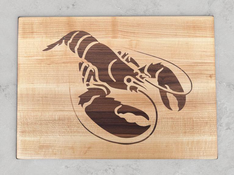 Edge-grain maple cutting board with a walnut inlay