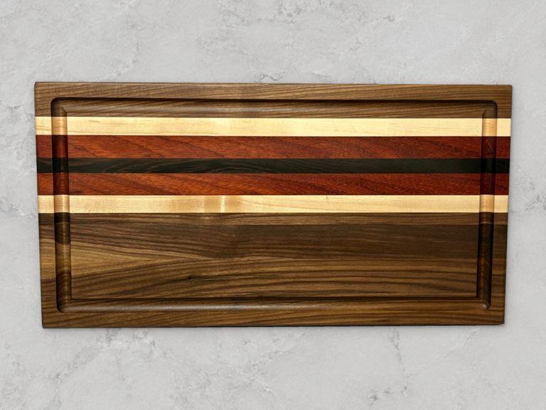 Walnut edge-grain cutting board with accent stripes
