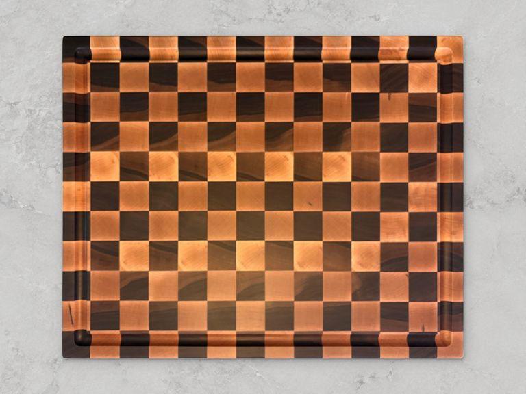 End-grain maple and walnut checkered board with a juice groove. 